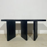 a row of black chairs sitting next to each other